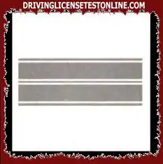 The double continuous longitudinal stripe shown allows overtaking, if allowed, without crossing it