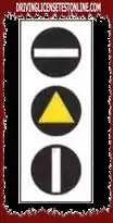 The traffic light in the figure allows public transport vehicles to continue when the white bar is lit at the bottom