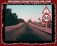 Förbudet mot att köra med en högre hastighet än den som visas på skylten på fotografiet slutar när . . .