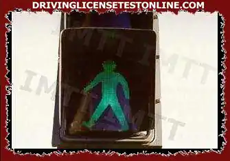 At the signal, a pedestrian can cross: