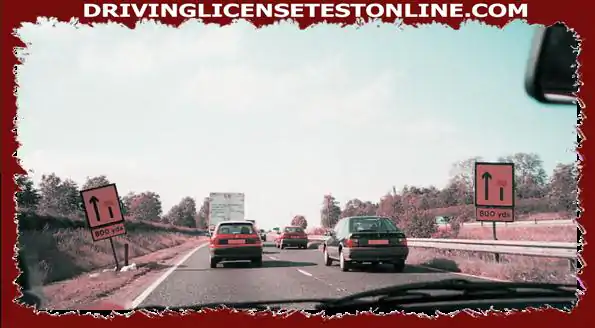 Ahead, traffic slows in the left lane. . What should you do ?