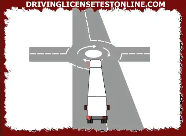 You are approaching a small circular intersection. What should you do when you see a long...