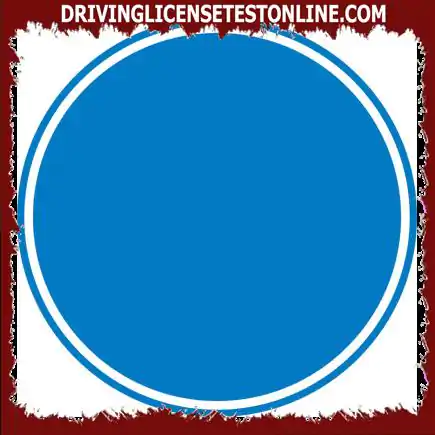 What does a circular traffic light with a blue background do ?