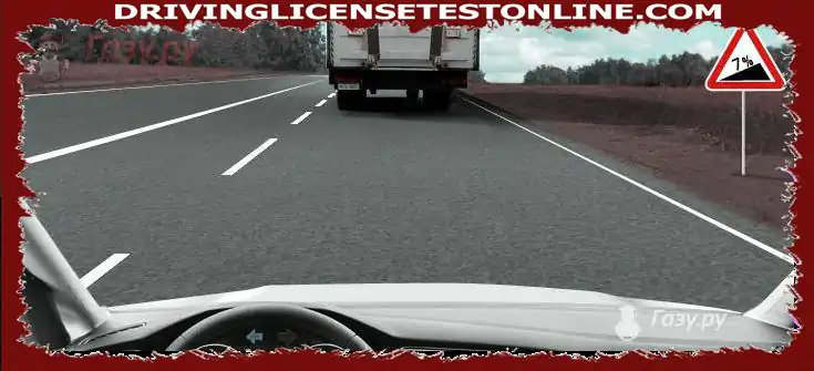 Are you allowed at the end of the rise to change lanes to the middle lane to get ahead of the truck ?