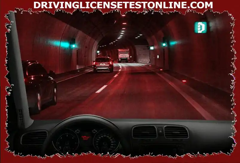You are driving in this tunnel at 80 km / h . Suddenly this control lamp lights up . How will you behave ?