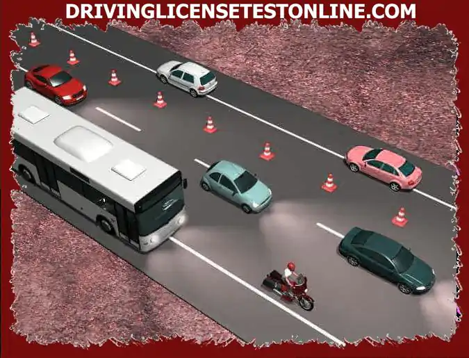 A bus travels on the shoulder of a road on which an additional circumstantial lane has been...