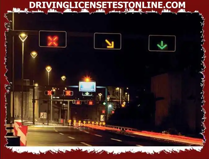 In this photo, there is a traffic light above each lane with different indications . Which lane vehicles can use ?