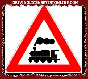 Road signs: | The sign shown indicates a level crossing with barriers