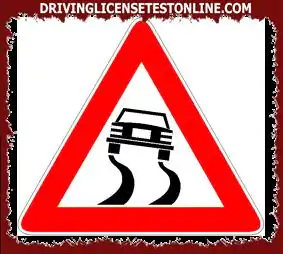 The sign shown | indicates that the braking distance will decrease on that road