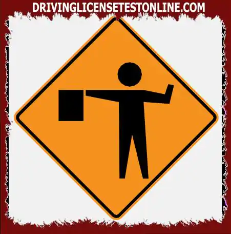 Que devez-vous faire si vous voyez le signal d'un signaleur en conduisant sur la route
