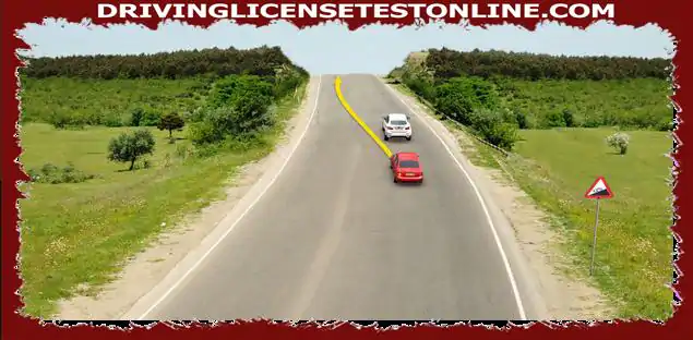 Whether the driver of the red car is prohibited from performing the overtaking maneuver by crossing the opposite lane ?